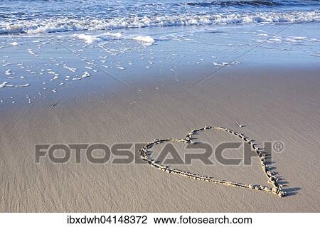 Stock Image - Heart in the sand, East Frisia, Lower Saxon Wadden Sea National Park, Lower Saxony, Germany, Europe. Fotosearch