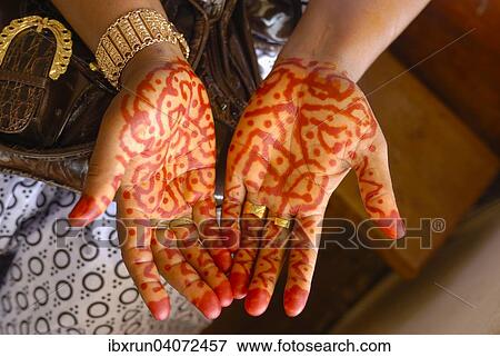 Henna-painting on hands at a wedding ceremony, Grande Comore, Comoros, Africa View Large Photo Image Stock Photo - Henna-painting on hands at a wedding ceremony, Grande Comore, Comoros, Africa. Fotosearch