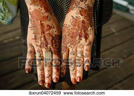 Stock Photo - Henna-painting on hands at a wedding ceremony, Grande Comore, Comoros, Africa. Fotosearch