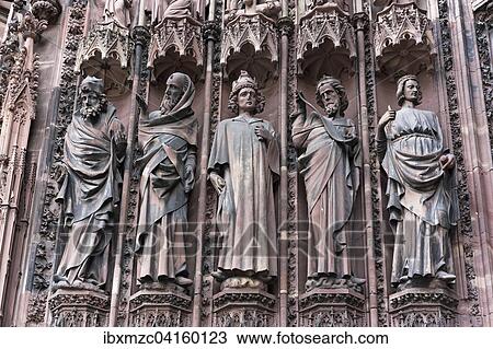 Stock Image - High Gothic jamb statues on the main portal of the west facade of the Strasbourg Cathedral, Strasbourg, elass, France, Europe. Fotosearch