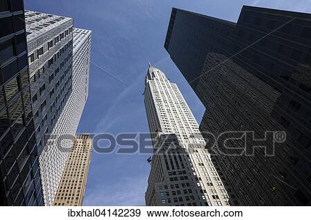 High-rise buildings, skyscrapers, the Chrysler Building in the middle, Manhattan, New York, USA View Large Photo Image Stock Photo - High-rise buildings, skyscrapers, the Chrysler Building in the middle, Manhattan, New York, USA. Fotosearch
