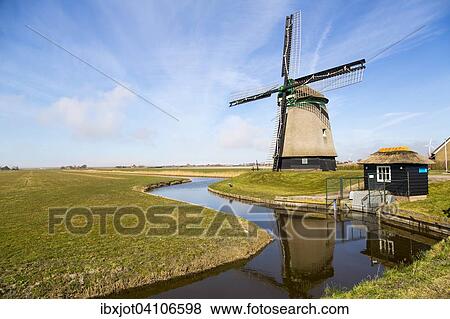 Historic windmill from 1598 by a canal, Burgervlothbrug, North Holland, The Netherlands, Europe View Large Photo Image Stock Photo - Historic windmill from 1598 by a canal, Burgervlothbrug, North Holland, The Netherlands, Europe. Fotosearch