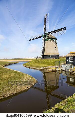 Historic windmill from 1598 by a canal, Burgervlothbrug, North Holland, The Netherlands, Europe View Large Photo Image Stock Photo - Historic windmill from 1598 by a canal, Burgervlothbrug, North Holland, The Netherlands, Europe. Fotosearch
