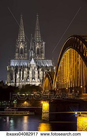 Hohenzollern Bridge, illuminated at night, Cologne Cathedral behind, Cologne, North Rhine-Westphalia, Germany, Europe View Large Photo Image Stock Photo - Hohenzollern Bridge, illuminated at night, Cologne Cathedral behind, Cologne, North Rhine-Westphalia, Germany, Europe. Fotosearch