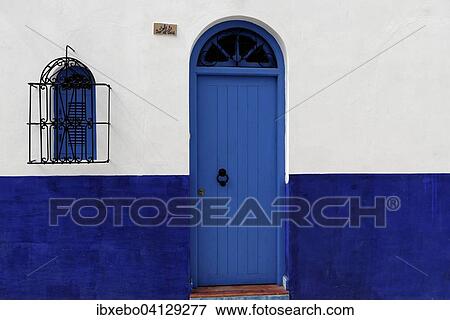 Stock Photo - Housing front with blue front door, Asilah, Morocco, Africa. Fotosearch