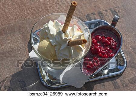 Ice cream sundae with whipped cream and hot raspberries View Large Photo Image Stock Photo - Ice cream sundae with whipped cream and hot raspberries. Fotosearch