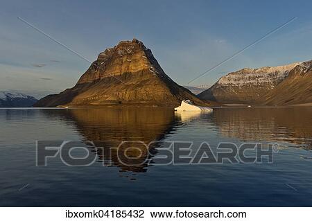 Iceberg in front of Devil's Castle mountain, Kejser Franz Joseph Fjord, Northeast Greenland National Park, Greenland, North America View Large Photo Image Stock Image - Iceberg in front of Devil's Castle mountain, Kejser Franz Joseph Fjord, Northeast Greenland National Park, Greenland, North America. Fotosearch