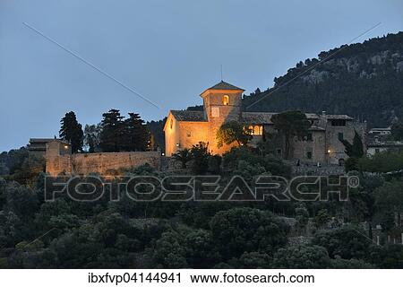 Stock Image - Iglesia de San Juan Bautista church in the evening light, Deia, Serra de Tramuntana, Majorca, Balearic Islands, Spain, Europe. Fotosearch