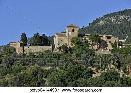 Stock Photo - Iglesia de San Juan Bautista church, Deia, Serra de Tramuntana, Majorca, Balearic Islands, Spain, Europe. Fotosearch