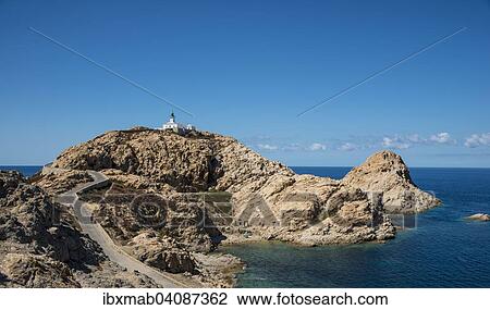 Stock Image - Ile de la Pietra with lighthouse at the tip of L'Ile-Rousse, Haute-Corse, Corsica, France, Europe. Fotosearch