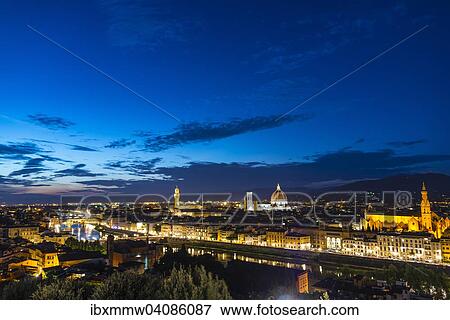 Stock Photo - Illuminated city panorama at dusk with Florence Cathedral, Duomo Santa Maria del Fiore with the dome by Brunelleschi, Palazzo Vecchio, Ponte Vecchio, UNESCO World Heritage Site, Florence, Tuscany, Italy, Europe. Fotosearch