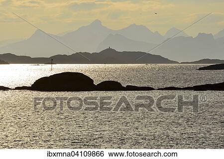Stock Photograph - Island landscape in front of Svolvaer, sparkling water and rocky islands, Svolvaer, Lofoten, Nordland, Norway, Europe. Fotosearch