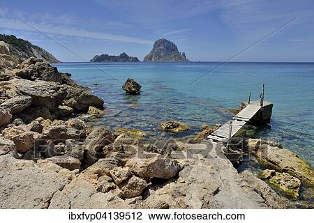 Stock Image - Jetty near the beach of Cala d'Hort, Sant Josep de sa Talaia, Ibiza, Balearic Islands, Spain, Europe. Fotosearch