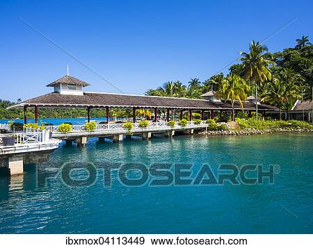 Stock Photo - Ken Wright terminal for cruise ships, Erol Flynn marina and harbor, Port Antonio, Portland region, Jamaica, North America. Fotosearch