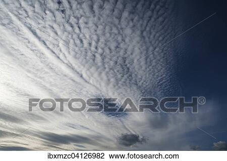 Stock Image - Large fluffy clouds, altocumulus. Fotosearch