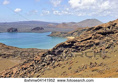 Lava landscape, Bartolome Island, Santiago Island, also San Salvador Island, behind, Galapagos Province, Galapagos Islands, Ecuador, South America View Large Photo Image Stock Image - Lava landscape, Bartolome Island, Santiago Island, also San Salvador Island, behind, Galapagos Province, Galapagos Islands, Ecuador, South America. Fotosearch