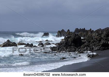 Lava rocks in the sea, surf, near Los Hervideros, Lanzarote, Canary Islands, Spain, Europe View Large Photo Image Stock Image - Lava rocks in the sea, surf, near Los Hervideros, Lanzarote, Canary Islands, Spain, Europe. Fotosearch