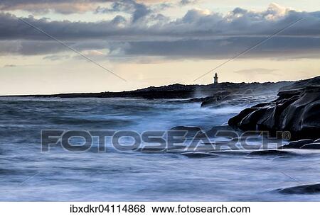 Lighthouse by the coast, high tide, Inis Oirr, Aran Islands, Ireland, Europe View Large Photo Image Stock Photo - Lighthouse by the coast, high tide, Inis Oirr, Aran Islands, Ireland, Europe. Fotosearch