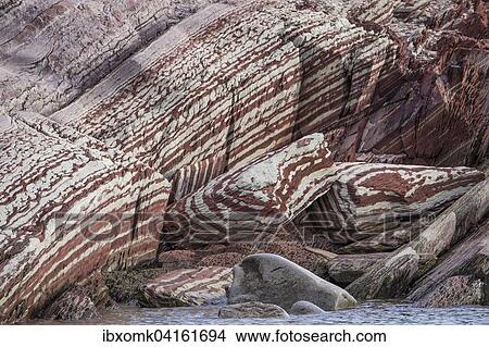 Limestone coloured red by iron and whitish-yellow dolomite, Segelsallskapet Fjord, Northeast Greenland National Park, Greenland, North America View Large Photo Image Picture - Limestone coloured red by iron and whitish-yellow dolomite, Segelsallskapet Fjord, Northeast Greenland National Park, Greenland, North America. Fotosearch