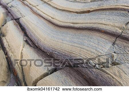 Stock Image - Limestone coloured red by iron and whitish-yellow dolomite, Segelsallskapet Fjord, Northeast Greenland National Park, Greenland, North America. Fotosearch