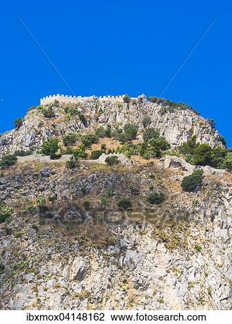 Stock Image - Limestone rock Rocca di Cefalu, with the Castello di Cefalu, Cefalu, Province of Palermo, Sicily, Italy, Europe. Fotosearch