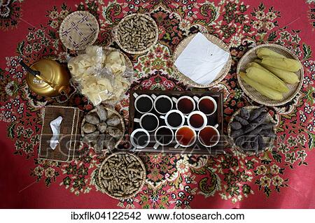 Local food, tea and coffee on a red carpet, Gampong Nusa, Aceh, Indonesia, Asia View Large Photo Image Stock Image - Local food, tea and coffee on a red carpet, Gampong Nusa, Aceh, Indonesia, Asia. Fotosearch