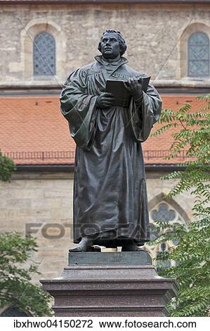 Stock Image - Luther monument with pedestal, 1889, Kaufmannskirche church behind, historic centre, Erfurt, Thuringia, Germany, Europe. Fotosearch