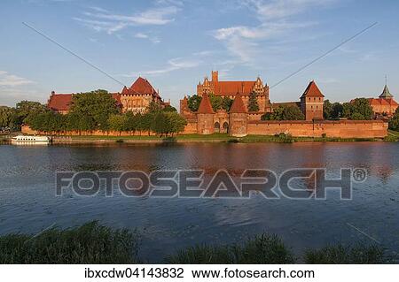 Malbork Castle in the evening light, Malbork, Pomerania Province, Poland, Europe View Large Photo Image Stock Image - Malbork Castle in the evening light, Malbork, Pomerania Province, Poland, Europe. Fotosearch
