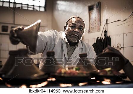 Man preparing traditional food, tajine, restaurant, Agadir, Morocco, Africa View Large Photo Image Stock Image - Man preparing traditional food, tajine, restaurant, Agadir, Morocco, Africa. Fotosearch
