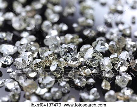 Many valuable diamonds, raw and cut, for further processing for the jewelery industry View Large Photo Image Stock Photo - Many valuable diamonds, raw and cut, for further processing for the jewelery industry. Fotosearch