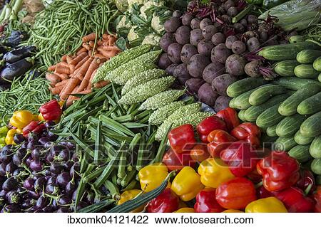 Stock Image - Market stall with okra, cauliflower, beets, carrots, eggplant, cucumbers, peppers, Mattancherry, Kochi, Cochin, Kerala, India, Asia. Fotosearch