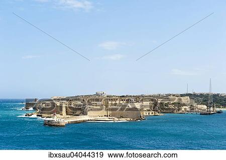 Stock Photo - Medieval fortress walls, views of Fort Rikazoli in Kalkara from Valletta, Malta, Europe. Fotosearch