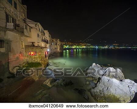 Stock Photo - Medieval houses on the beach of Cefalu at night, Cefalu, Province of Palermo, Sicily, Italy, Europe. Fotosearch