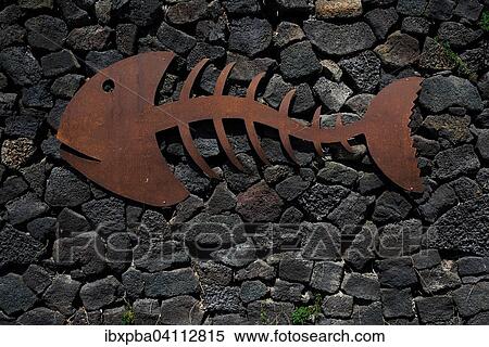 Metal fish on a stone wall, Lanzarote, Canary Islands, Spain, Europe View Large Photo Image Stock Photography - Metal fish on a stone wall, Lanzarote, Canary Islands, Spain, Europe. Fotosearch
