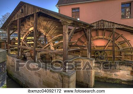 Stock Image - Mill wheels of the grinding mill, 1541, Lauf an der Pegnitz, Middle Franconia, Bavaria, Germany, Europe. Fotosearch