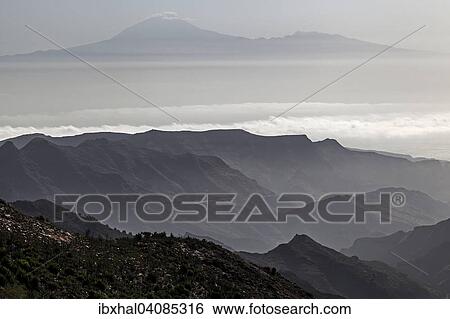 Stock Photograph - Mirador de Degollada Paraza view to the east of La Gomera and Mount Teide on Tenerife, La Gomera, Canary Islands, Spain, Europe. Fotosearch