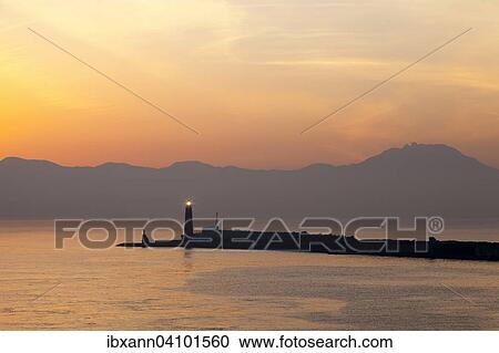 Stock Image - Molo San Vincenzo, harbor entrance at sunrise, Naples, Campania, Italy, Europe. Fotosearch