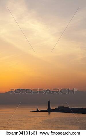 Stock Image - Molo San Vincenzo, harbor entrance at sunrise, Naples, Campania, Italy, Europe. Fotosearch