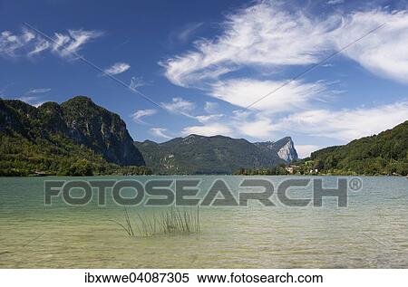 Mondsee lake with Drachenwand rock wall at the back, Salzkammergut, Upper Austria, Austria, Europe View Large Photo Image Stock Photography - Mondsee lake with Drachenwand rock wall at the back, Salzkammergut, Upper Austria, Austria, Europe. Fotosearch