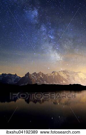 Mont Blanc massif at night with the Milky Way, reflected in Lac de Chesserys, Montblanc on the right, Chamonix, France, Europe View Large Photo Image Stock Photo - Mont Blanc massif at night with the Milky Way, reflected in Lac de Chesserys, Montblanc on the right, Chamonix, France, Europe. Fotosearch