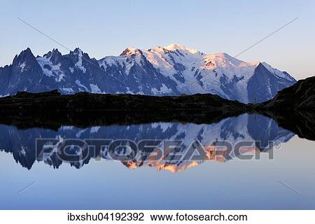 Mont Blanc massif at sunrise reflected in Lac de Chesserys, Montblanc on the right, Chamonix, France, Europe View Large Photo Image Stock Image - Mont Blanc massif at sunrise reflected in Lac de Chesserys, Montblanc on the right, Chamonix, France, Europe. Fotosearch