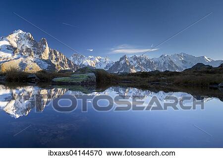 Stock Image - Mont Blanc massif reflected in the Lac des Chesery, Chamonix, Rhone-Alpes, France, Europe. Fotosearch