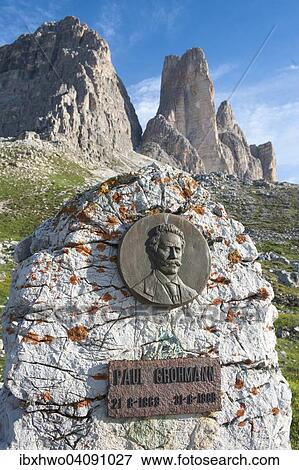 Stock Photo - Monument Paul Grohmann, 1838-1908, Austrian mountaineer, bronze relief of Galdini, 1969, behind Three Peaks, Dolomites, Veneto, Italy, Europe. Fotosearch