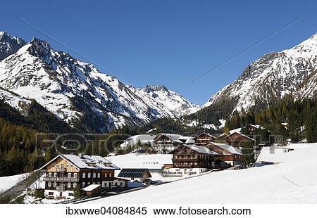 Stock Photography - Mountain farms in a snow-capped mountain landscape, High Tauern National Park, Kalser Tal valley, Kals am Grossglockner, Tyrol, Austria, Europe. Fotosearch