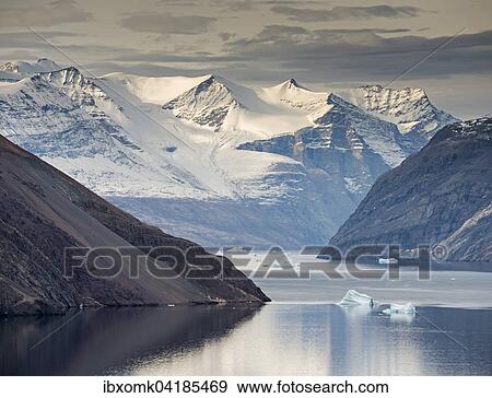 Mountain slopes and snowy mountains, icebergs in the Blomsterbugten, Kejser Franz Joseph Fjord, Northeast Greenland National Park, Greenland, North America View Large Photo Image Stock Photo - Mountain slopes and snowy mountains, icebergs in the Blomsterbugten, Kejser Franz Joseph Fjord, Northeast Greenland National Park, Greenland, North America. Fotosearch