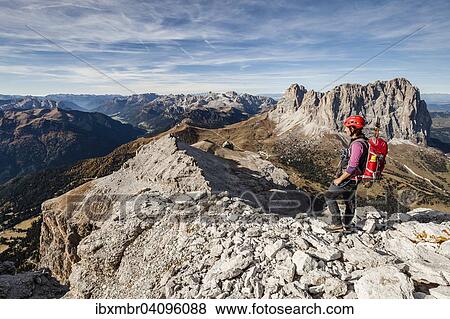 Mountaineer on the Piz Selva above the Possnecker climbing range, Sellajoch, Langkofel and Plattkofel behind, Dolomites, Val Gardena, South Tyrol, Trentino, Italy, Europe View Large Photo Image Stock Photo - Mountaineer on the Piz Selva above the Possnecker climbing range, Sellajoch, Langkofel and Plattkofel behind, Dolomites, Val Gardena, South Tyrol, Trentino, Italy, Europe. Fotosearch