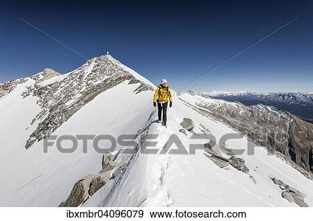 Mountaineer on the summit ridge descending from the Hoher Weisszint, Zillertal Alps, Province of South Tyrol, Italy, Europe View Large Photo Image Stock Photo - Mountaineer on the summit ridge descending from the Hoher Weisszint, Zillertal Alps, Province of South Tyrol, Italy, Europe. Fotosearch