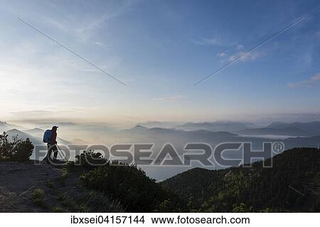 Mountaineers in the early morning with the Bavarian Alps, Herzogstand, lake Walchensee, Upper Bavaria, Bavaria, Germany, Europe View Large Photo Image Picture - Mountaineers in the early morning with the Bavarian Alps, Herzogstand, lake Walchensee, Upper Bavaria, Bavaria, Germany, Europe. Fotosearch