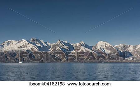 Stock Photo - Mountains, Holmbugt, Kong Oscar Fjord, Northeast Greenland National Park, Greenland, North America. Fotosearch