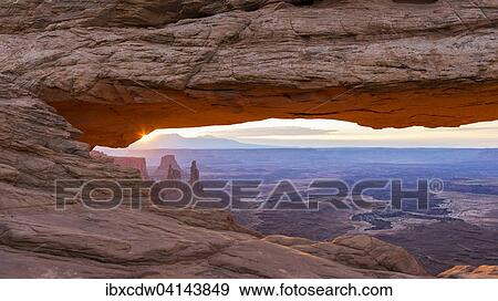 Stock Photo - Natural arch, Mesa Arch, sunrise, Grand View Point Road, Canyonlands, Utah, USA. Fotosearch